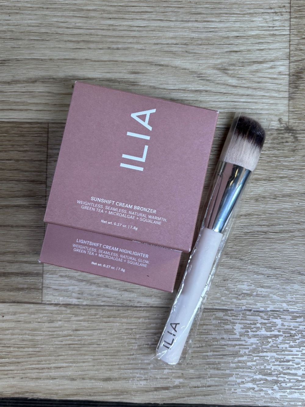 ILIA Sunshift Cream Bronzer, Lightshift Cream Highlighter, and Sculpting Brush